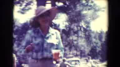 Flagstaff Arizona USA (1967): A Woman In Casual Clothing Carries A Drink While