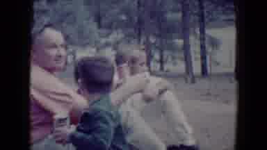 Flagstaff Arizona USA (1967): A Family Out In Forrest Sitting Around Father Looks
