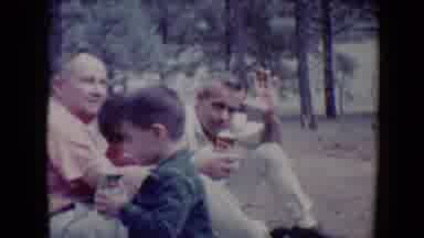 Flagstaff Arizona USA (1967): Man Wearing White Pants Sits On Ground Holding Red
