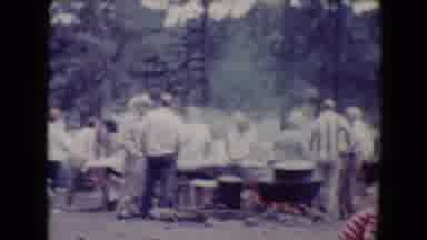 Flagstaff Arizona USA (1967): Men All Stand Around A Campfire Preparing Food For