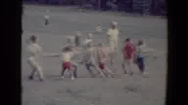 Flagstaff Arizona USA (1967): Several Children Play Tug Of War In The Field As