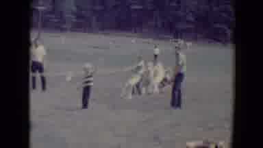 Flagstaff Arizona USA (1967): Kids Having Fun In Park Playing Tug-O-War With Adult