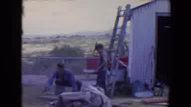 Flagstaff Arizona USA (1967): Father And Son Building Something In Backyard