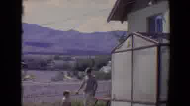 Flagstaff Arizona USA (1967): A Man Is Walking In And Around The House With His