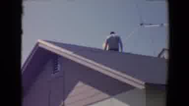 Flagstaff Arizona USA (1967): Dad And Son Working Together At Home Under Sunshine