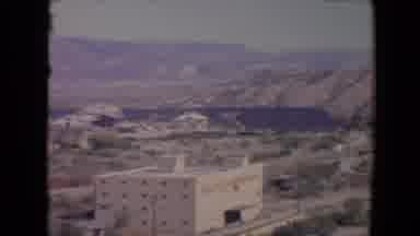Flagstaff Arizona USA (1967): A Multi-Storied Building Sits In A Desert Valley