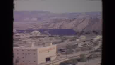 Flagstaff Arizona USA (1967): A Incomplete House With A Long Tank With Mountain,