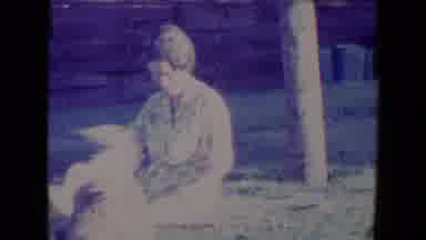 Tucson Arizona USA (1967): A Woman Sitting In The Grass Tossing A Toy To A Dog