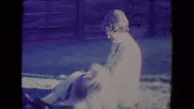 Tucson Arizona USA (1967): Woman Sitting Outside On A Sunny Day Playing With Dog
