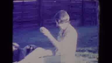 Tucson Arizona USA (1967): Woman Plays With Dog Outside Her Residence On A Sunny