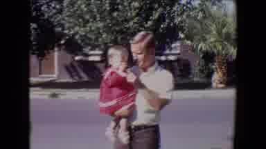 Tucson Arizona USA (1967): Father With Child On His Lap In Front Of His House