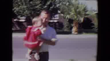 Tucson Arizona USA (1967): A Man Holds His Baby Girl With His Wife And Little Boy
