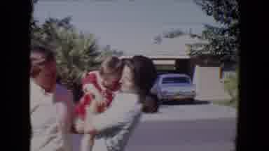 Tucson Arizona USA (1967): Father Giving Her Baby To Her Mother To Hold