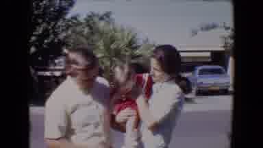 Tucson Arizona USA (1967): Mother Holds Baby And Encourages The Baby To Waves At