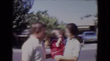 Tucson Arizona USA (1967): Mother Holding Her Child Try To Make Her Baby Wave For