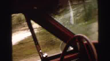 Yellowstone Wyoming USA (1967): Man Driving Down The Road With Windshield Wipers