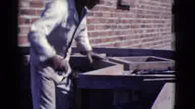 Cottonwood Arizona (1968): A Man In A White Uniform Works With Cement Or Mortar