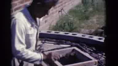 Cottonwood Arizona (1968): Man In Overalls Outside Spreading Mud On Workbench For