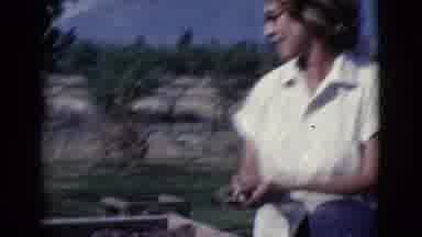 Cottonwood Arizona (1968): Woman Takes Spatula Off A Freshly Made Wall In A
