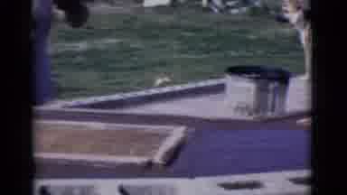 Cottonwood Arizona (1968): Person Wearing White Shirt Works On Outdoor Object On A