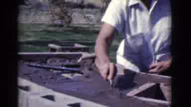 Cottonwood Arizona (1968): Two Mean Wearing White Shirts Construct Outdoor Object