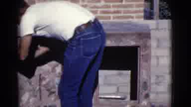 Cottonwood Arizona (1968): Man In Blue Jeans And White Shirt Builds Outdoor