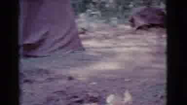Cottonwood Arizona (1968): Man Wearing Blue Shirt Looks At Woman Wearing White