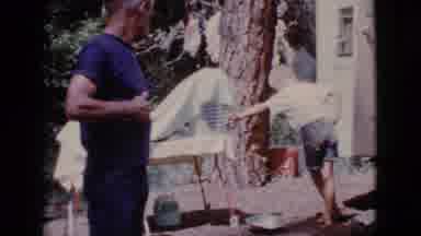 Cottonwood Arizona (1968): A Woman Leans On A Table And A Man Scratches Himself At