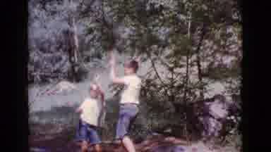 Cottonwood Arizona (1968): Two Young Boys Playing Together On A Rope Swing Tied To