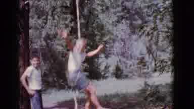 Cottonwood Arizona (1968): Two Young Boys Playing On A Rope Swing That Is Hung