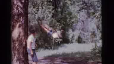 Cottonwood Arizona (1968): A Boy Is Swinging With The Help Of Rope And Another Boy
