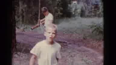 Cottonwood Arizona (1968): Two Young Boys Tying Together A Rope Swing Off Of A