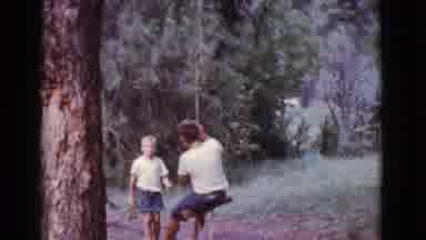 Cottonwood Arizona (1968): One Boy Pushes Another Boy On Tree Swing In Forest
