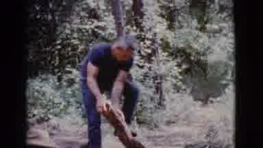 Cottonwood Arizona (1968): Man Trying To Break Apart Logs That Are Partially Sawn
