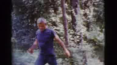 Cottonwood Arizona (1968): Man Throwing Logs While Children Play On The Beach