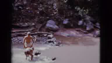 Cottonwood Arizona (1968): Two Boys In Shorts In Fast Flowing Stream Building A