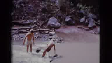 Cottonwood Arizona (1968): Two Happy Kids Playing At The Lake And An Adult Sawing