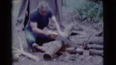 Cottonwood Arizona (1968): Man Working Hard Using A Hand Saw To Cut Firewood At A