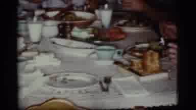 Cottonwood Arizona (1968): Man Eating Large Meal With Others At Dining Room Table
