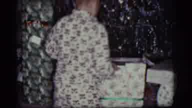 Cottonwood Arizona (1968): A Boy Is Unboxing A Gift In Front Of A Christmas Tree