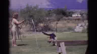 Cottonwood Arizona (1968): Woman Plays With Her Dog Outside Her Home On A Typical