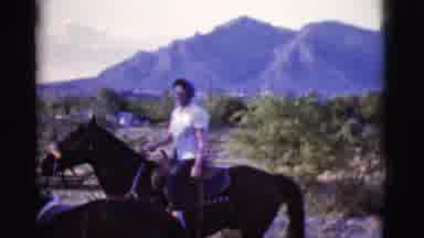 Cottonwood Arizona (1968): Person On Top Of Big Horse With White Shirt And Scarf