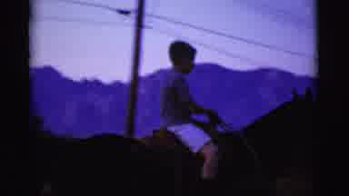 Cottonwood Arizona (1968): Young Boy Rides A Horse While Two Women Speak Outside