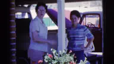 Cottonwood Arizona (1968): Two Women Talking And Behind Them A Man Entering A