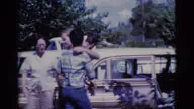 Cottonwood Arizona (1968): People Pose For A Picture In A Parking Lot Outside