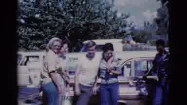 Cottonwood Arizona (1968): Five Cheerful People Holding Hands Gathered In Front Of