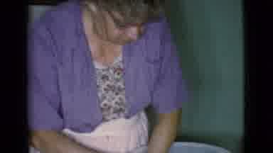 Cottonwood Arizona (1968): Older Lady Scrubs Item In Large Bowl While Second Lady