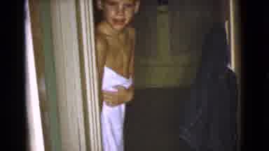 Cottonwood Arizona (1968): A Young Blonde Boy Walking Around Covered Only In A