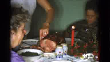 Cottonwood Arizona (1968): Woman Slices Ham And Places It On A Child's Plate At