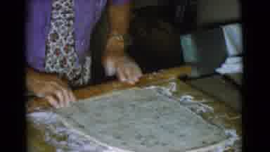Cottonwood Arizona (1968): Woman Wearing Purple Shirt Rolls Out Dough With Brown